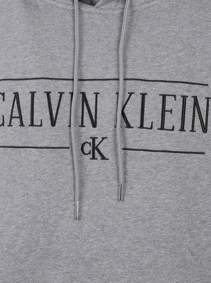 FELPA UOMO CON CAPPUCCIO LS 350FLEECE EU VARSITY - CALVIN KLEIN JEANS LV04RH238G P7E MED GREY HTR CALVIN KLEIN 